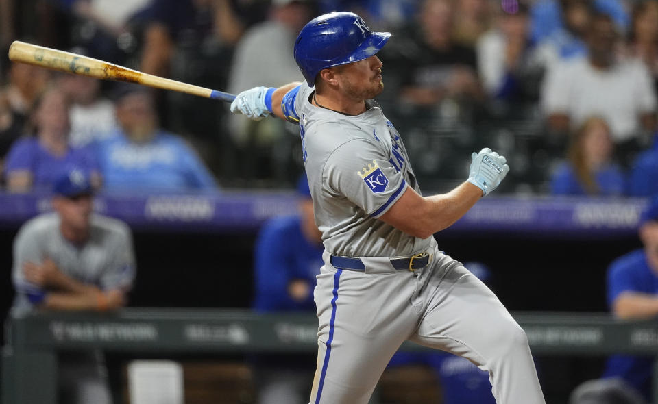 Kansas City Royals' Hunter Renfroe singles against Colorado Rockies relief pitcher Victor Vodnik in the ninth inning of a baseball game Saturday, July 6, 2024, in Denver. (AP Photo/David Zalubowski)