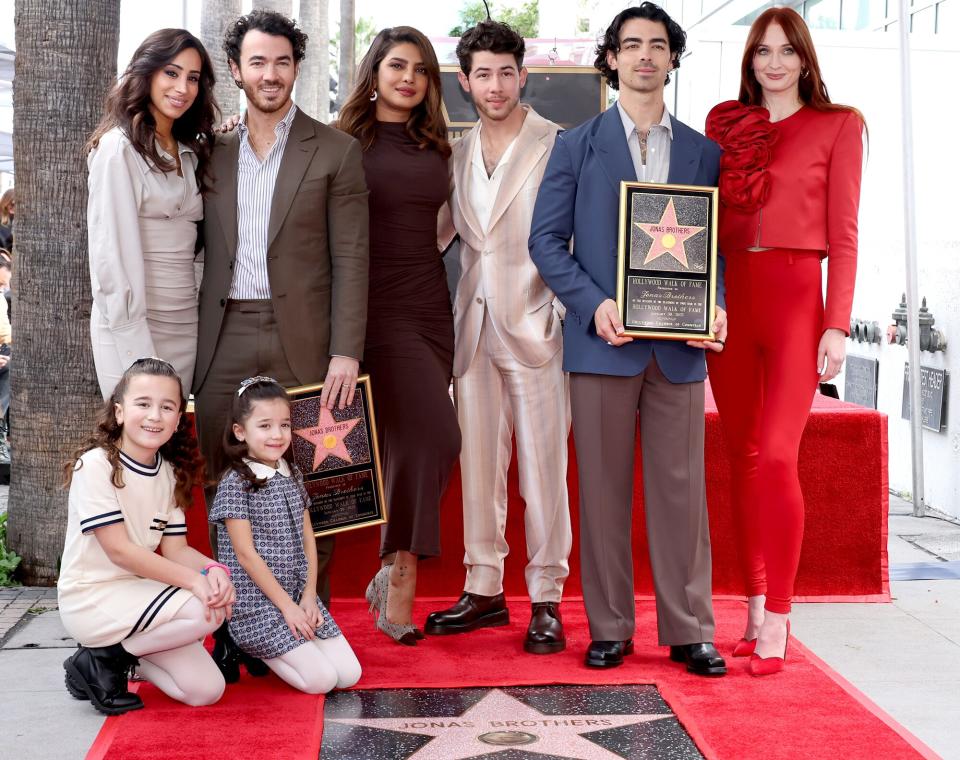 (L-R) Danielle Jonas, Kevin Jonas, Priyanka Chopra, Nick Jonas, Joe Jonas, Sophie Turner, and (front) Alena Rose Jonas and Valentina Angelina Jonas attend The Hollywood Walk of Fame star ceremony honoring The Jonas Brothers on January 30, 2023 in Hollywood, California.