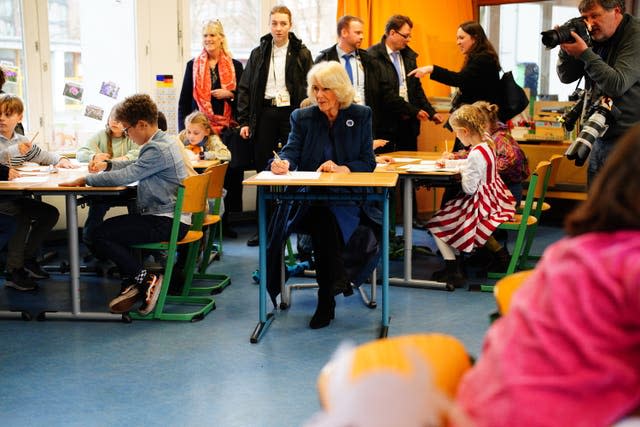 The Queen Consort drawing the Gruffalo, during a visit to Rudolf Ross Grundschule School, Hamburg 