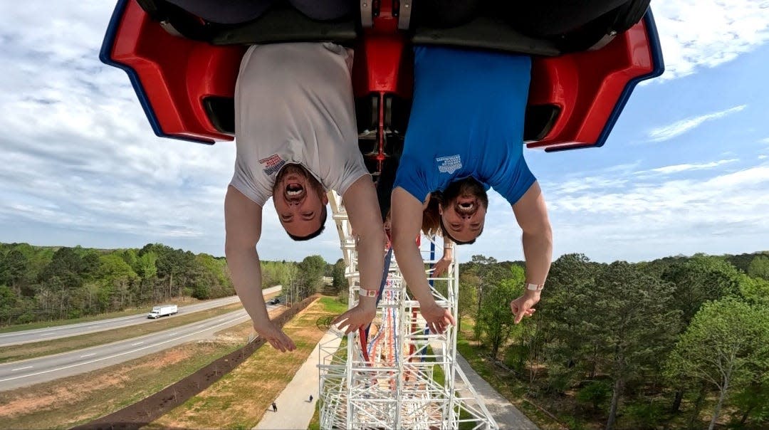 Doug and Derek Perry ride ArieForce One at Fun Spot Atlanta with other ACE members on opening day. The new coaster features a" first-ever raven-truss dive" and the "largest zero-G stall in America.
