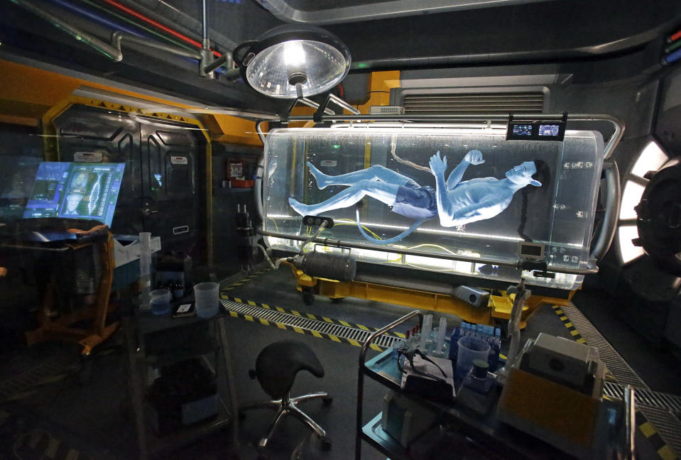 A Na'vi in a science lab is shown and will be seen while guests are in the queue for the Avatar Flight of Passage ride. (AP Photo/John Raoux)