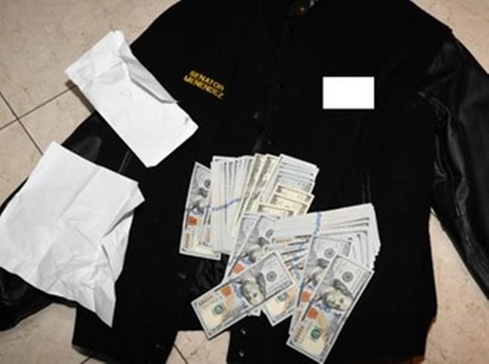 Photo of a jacket and some $500,00 in cash found stuffed in clothing and envelopes during a 2022 search by federal agents and pictured in the indictment against Sen. Bob Menendez, a New Jersey Democrat.