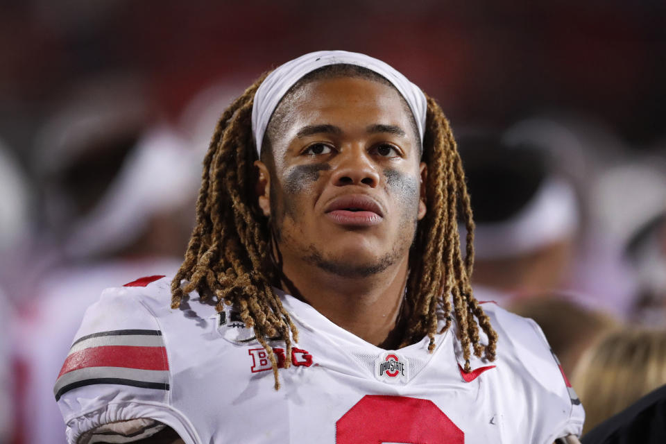FILE - In this Oct. 18, 2019, file photo, Ohio State defensive end Chase Young looks at the scoreboard during the second half of an NCAA college football game against Northwestern, in Evanston, Ill. Ohio State said, Wednesday, Nov. 13, 2019, the NCAA has concluded that star DE Chase Young must sit out one more football game before he can return.(AP Photo/Charles Rex Arbogast, File)