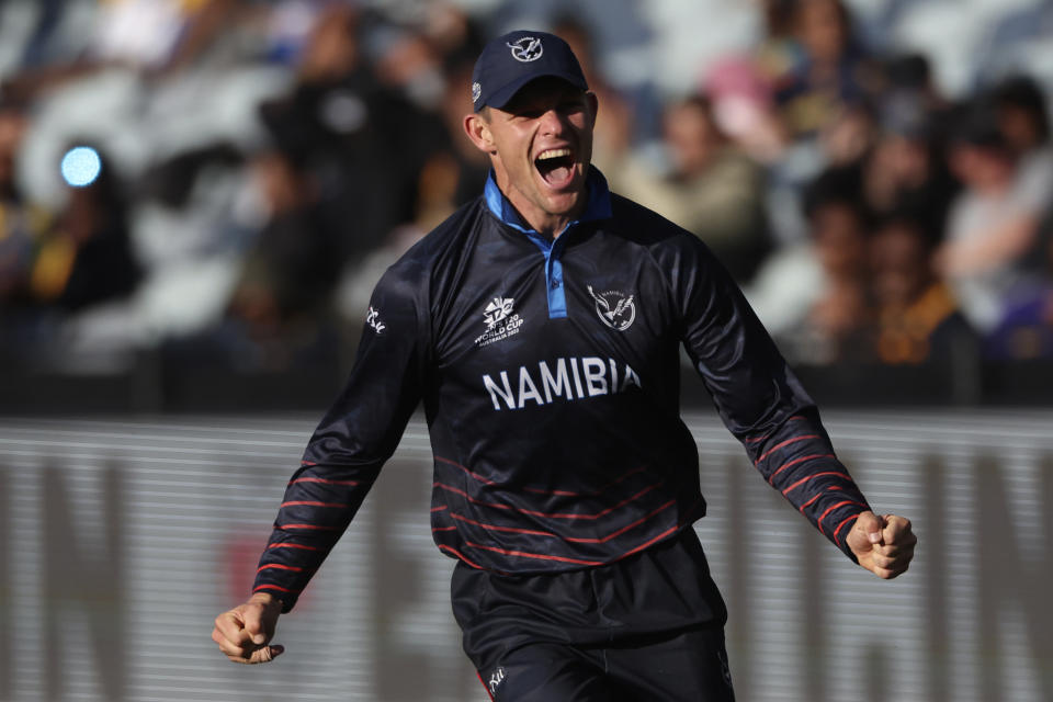 Namibia's Gerhard Erasmus celebrates after making the final out against Sri Lanka during their T20 World Cup Cricket match in Geelong, Australia, Sunday, Oct. 16, 2022. (AP Photo/Asanka Brendon Ratnayake)