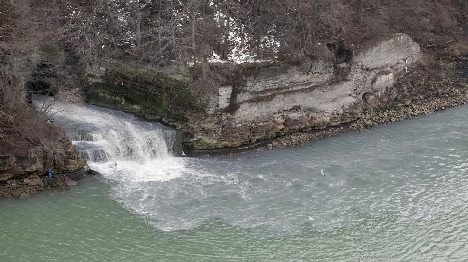 FILE - In this Feb. 17, 2012 file photo, effluent from the Niagara Falls Wastewater Treatment Plant is discharged into the Niagara River near the American Falls in Niagara Falls, N.Y. The Niagara Falls City Council voted Monday, March 5, 2012 to ban the treatment of wastewater from hydraulic fracturing. Leaders of the city that endured the Love Canal toxic waste crisis in the 1970s say they don’t want it to be a test case for so-called fracking waste. (AP Photo/David Duprey, File)