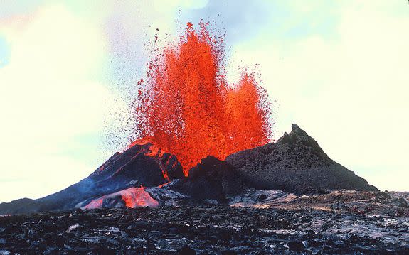 Puʻu ʻŌʻō" erupting in 1983. The cone would eventually reach 200 feet in height.