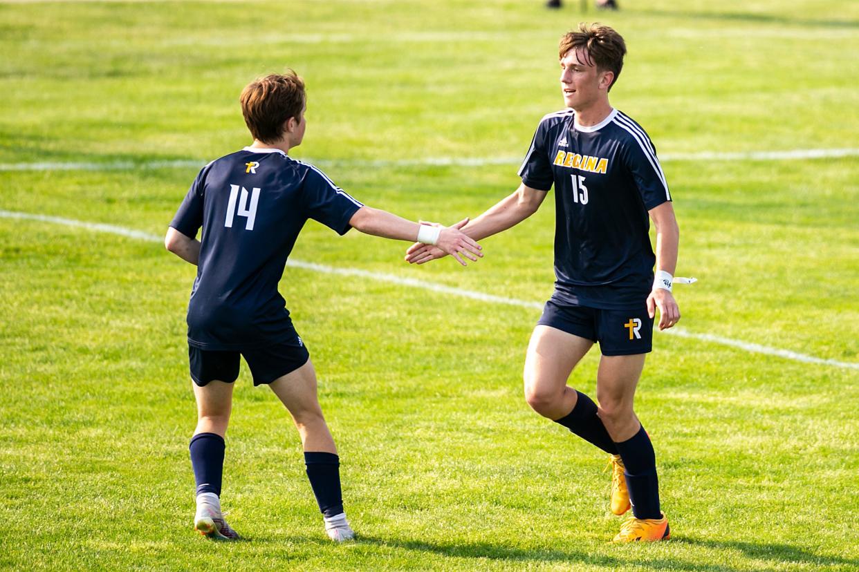 Iowa City Regina's Eddie Petersen, right, celebrates with teammate Jack Hoover after scoring a goal during a Class 1A substate regional final boys soccer game against Beckman Catholic on Wednesday, May 24, 2023, at Regina Catholic High School in Iowa City, Iowa.