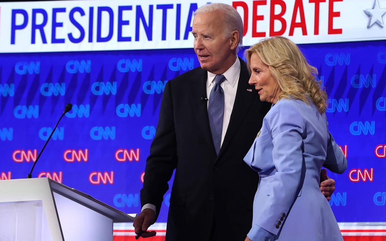 U.S. President Joe Biden embraces first lady Jill Biden following the CNN Presidential Debate at the CNN Studios