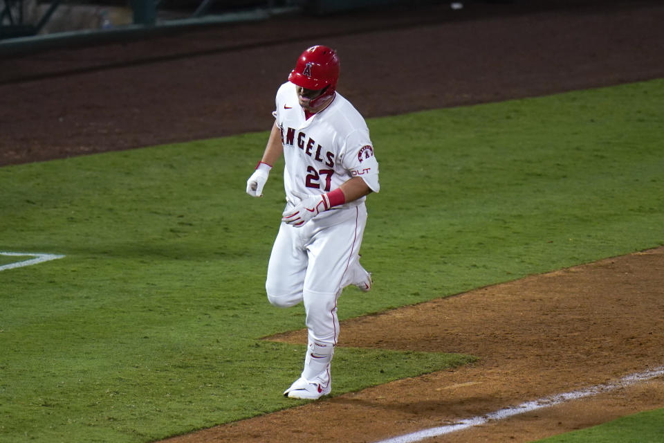 Los Angeles Angels' Mike Trout rounds the bases after hitting a home run during the eighth inning of a baseball game against the Oakland Athletics, Monday, Aug. 10, 2020, in Anaheim, Calif. (AP Photo/Jae C. Hong)