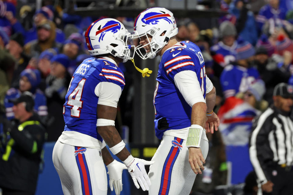 FILE - Buffalo Bills quarterback Josh Allen, right, and Stefon Diggs celebrate after a touchdown during the first half of an NFL football game against the New York Jets in Orchard Park, N.Y., Sunday, Nov. 19, 2023. No one is disputing Stefon Diggs’ status as the Buffalo’ Bills top threat. And quarterback Josh Allen once again insisted on Wednesday, Jan. 3, 2024 the importance of getting Diggs more involved. (AP Photo/Jeffrey T. Barnes, File)