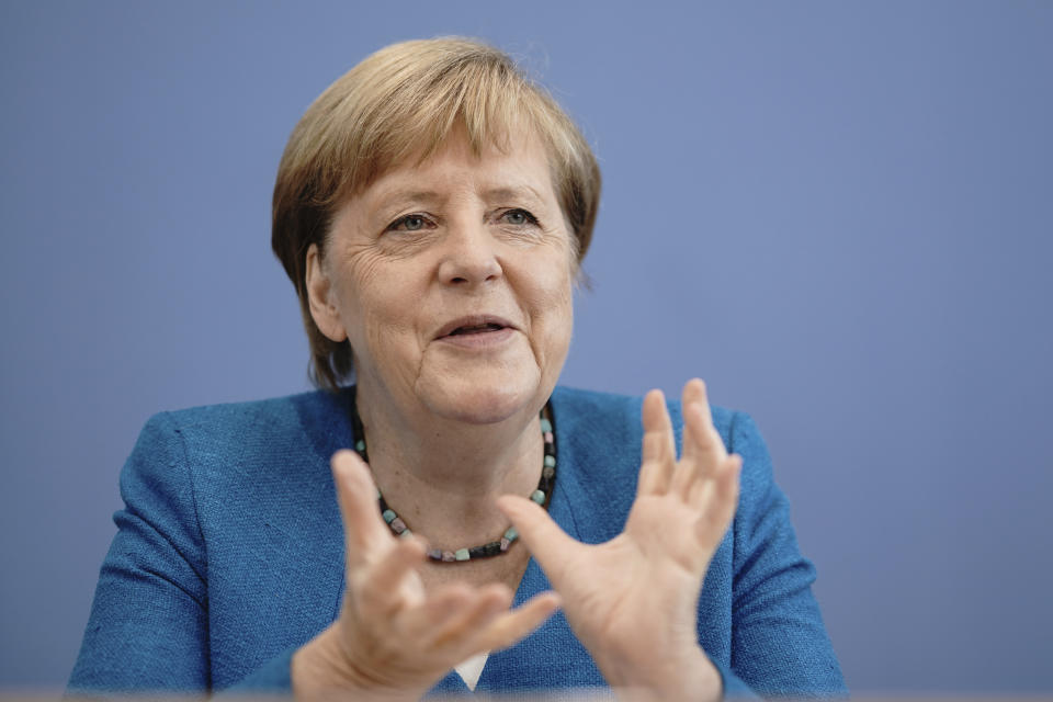 Chancellor Angela Merkel talks to the media at the Federal Press Conference during her traditional summer press conference on current domestic and foreign policy issues in Berlin, Germany, Friday, Aug. 28, 2020. (Michael Kappeler/Pool via AP)