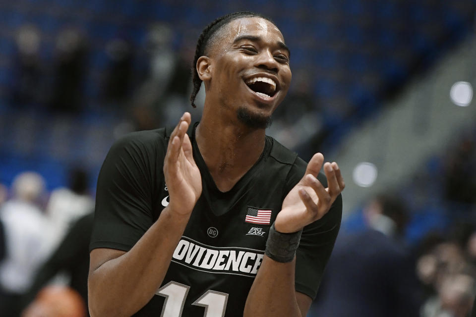 Providence's A.J. Reeves (11) celebrates his teams win at the end NCAA college basketball game against Connecticut, Saturday, Dec. 18, 2021, in Hartford, Conn. (AP Photo/Jessica Hill)
