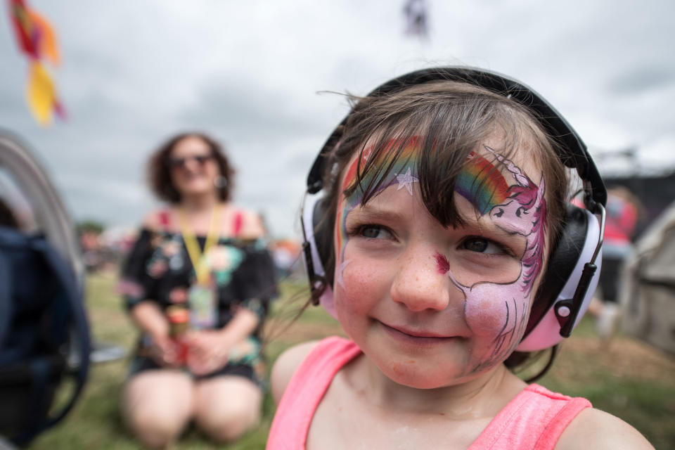 <p>Ellie Woods, 5, watches Charli XCX on The Other Stage with her parents at Glastonbury Festival Site on Worthy Farm in Pilton on June 23, 2017 near Glastonbury, England. (Photo: Chris J Ratcliffe/Getty Images) </p>