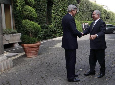 U.S. Secretary of State John Kerry (L) shakes hands with Israeli Prime Minister Benjamin Netanyahu at Villa Taverna in Rome October 23, 2013. REUTERS/Gregorio Borgia/Pool