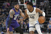 Memphis Grizzlies forward GG Jackson II (45) is defended by Charlotte Hornets forward Miles Bridges (0) during the first half of an NBA basketball game Wednesday, March 13, 2024, in Memphis, Tenn. (AP Photo/Brandon Dill)