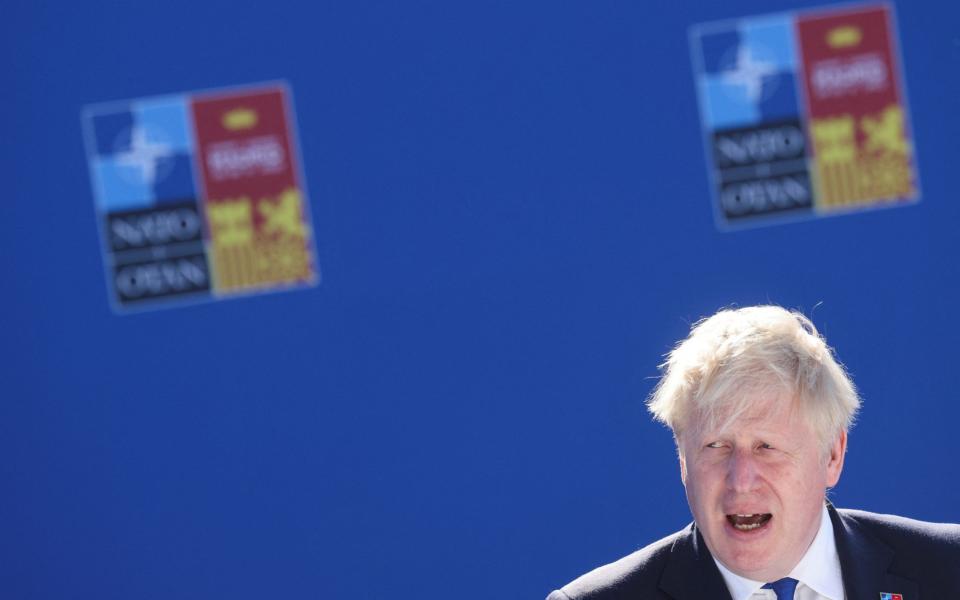 Boris Johnson speaks as he arrives at a Nato summit in Madrid this morning - Nacho Doce/Reuters