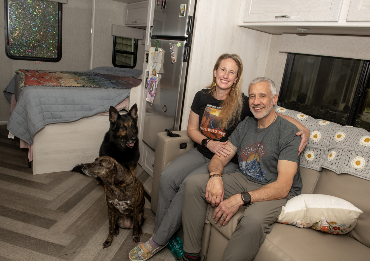 Melissa Cairns and her husband Mark Dailey in their RV with dogs Zeus and Aphrodite.