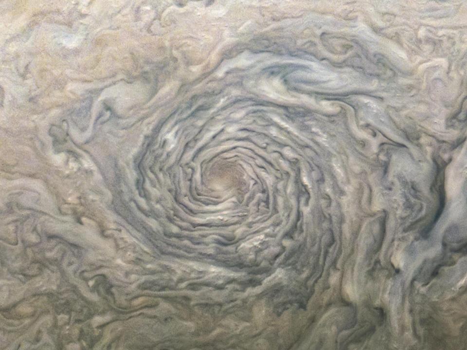 cyclone swirling clouds brown grey purple on jupiter