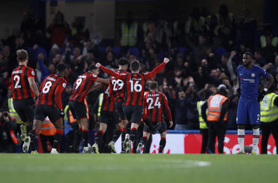 Bournemouth's Dan Gosling celebrates with teammates after scoring his side's opening goal during the English Premier League soccer match between Chelsea and Bournemouth, at Stamford Bridge in London, Saturday, Dec. 14, 2019. (AP Photo/Ian Walton)