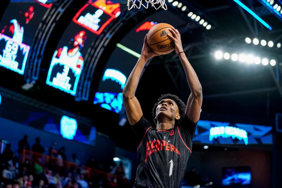 Overtime Elite guard Amen Thompson goes up for a dunk against the Cold Hearts during a game in Atlanta on Dec. 9, 2022.