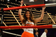 <p>A card girl from Hooters holds a ring card during the match between Brian Fielder and Brian Huang in the NYPD Boxing Championships at the Hulu Theater at Madison Square Garden on March 15, 2018. (Gordon Donovan/Yahoo News) </p>