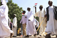 Sudanese protesters take part in a rally demanding the dissolution of the transitional government, outside the presidential palace in Khartoum, Sudan, Saturday, Oct. 16, 2021. (AP Photo/Marwan Ali)