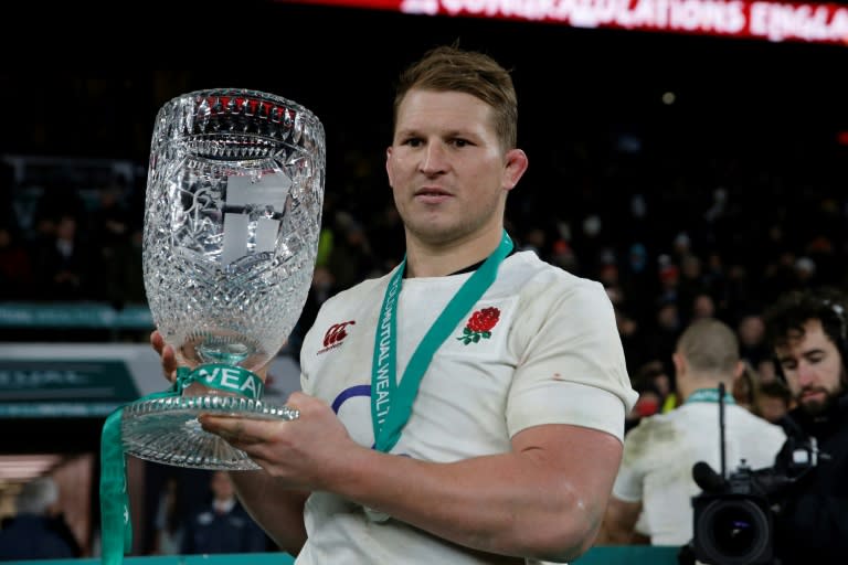 England captain Dylan Hartley holds the Cook Cup after their victory against Australia at Twickenham on December 3, 2016