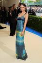 The actress went for a different, more demure look on the Met Gala red carpet in this deep blue Calvin Klein gown.