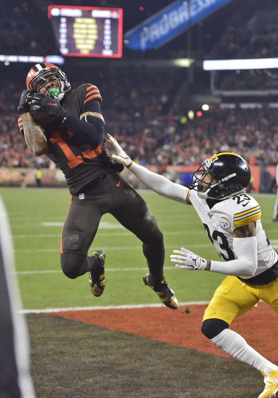 Cleveland Browns wide receiver Odell Beckham Jr., left, can't hold on to the ball under pressure from Pittsburgh Steelers cornerback Joe Haden during the second half of an NFL football game Thursday, Nov. 14, 2019, in Cleveland. (AP Photo/David Richard)