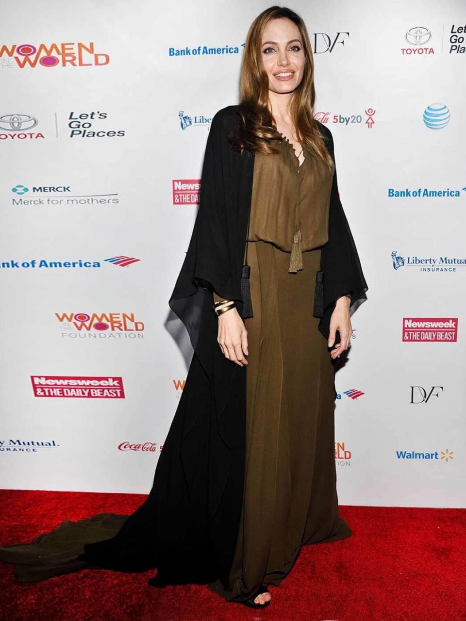 <p>Angelina Jolie is wearing an Yves Saint Laurent dress to attend the 4th Annual Women in the World Summit, April 2013</p>