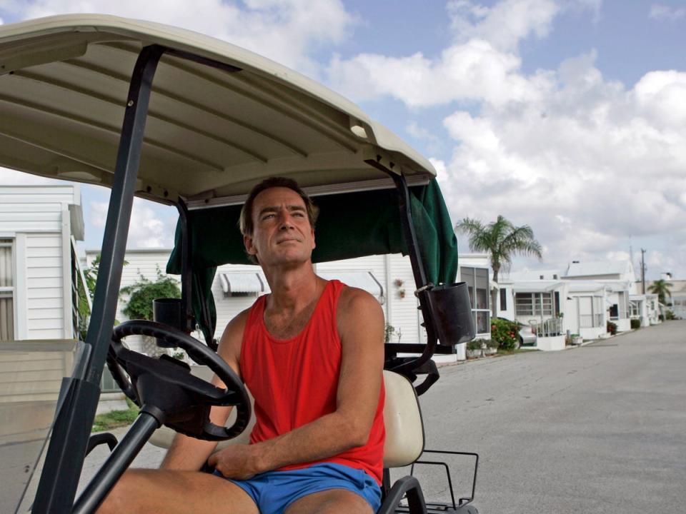 Kevin Dwyer sits in his golf cart at the Briny Breezes trailer park in Briny Breezes, Fla., Monday, Dec. 18, 2006. If residents approved the sale of the community to a developer for more than a half billion dollars, nearly each trailer owner would have become an instant millionaire. 