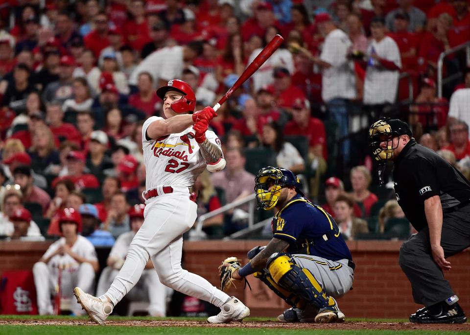 Tyler O'Neill hits a double during the third inning against the Brewers at Busch Stadium.