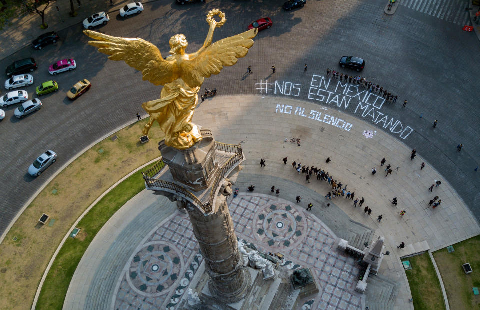 <p>View of the Angel of Independence monument where a dozen reporters gathered to write, “In Mexico they are killing us,” and “No to silence”, to call attention to the wave of journalist killings, in Mexico City, Tuesday, May 16, 2017. (Hector Vivas via Derecho a Informar via AP) </p>