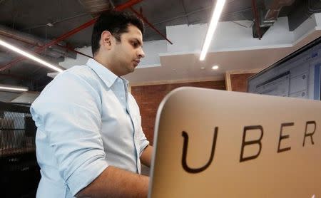 An employee works inside the office of ride-hailing service Uber in Gurugram, previously known as Gurgaon, on the outskirts of New Delhi, April 19, 2016. REUTERS/Anindito Mukherjee