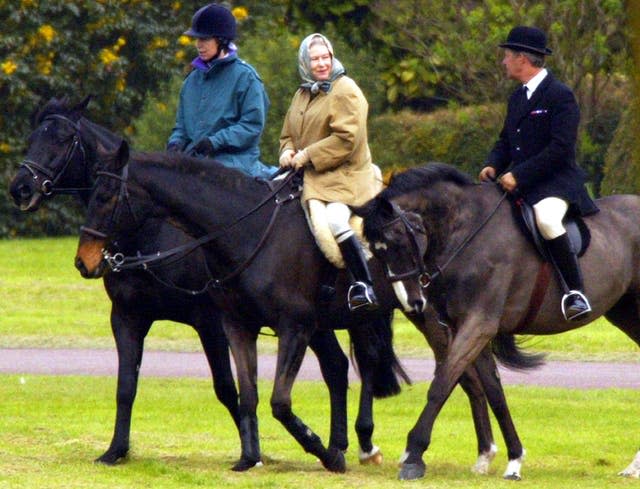 The Queen riding with the Princess Royal