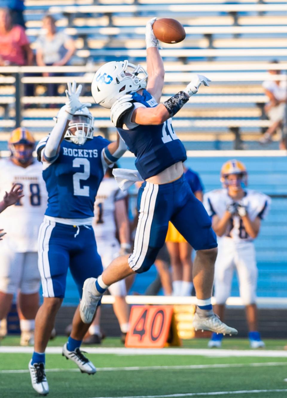 Spring Grove's Andrew Osmun makes a leaping one-handed interception in the first series of play against Waynesboro during a non-league home game on Friday, August 26, 2022, in Jackson Township.