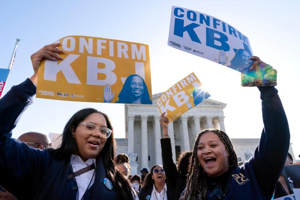 Supporters of Judge Ketanji Brown Jackson rally outside of the Supreme Court on Capitol Hill in Washington on Monday as the Senate Judiciary Committee begins historic confirmation hearings (AP)