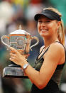 PARIS, FRANCE - JUNE 09: Maria Sharapova of Russia celebrates with the Coupe Suzanne Lenglen in the women's singles final against Sara Errani of Italy during day 14 of the French Open at Roland Garros on June 9, 2012 in Paris, France. (Photo by Matthew Stockman/Getty Images)