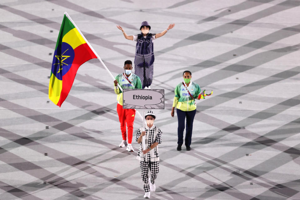 <p>TOKYO, JAPAN - JULY 23: Flag bearer Abdelmalik Muktar of Team Ethiopia during the Opening Ceremony of the Tokyo 2020 Olympic Games at Olympic Stadium on July 23, 2021 in Tokyo, Japan. (Photo by Clive Brunskill/Getty Images)</p> 