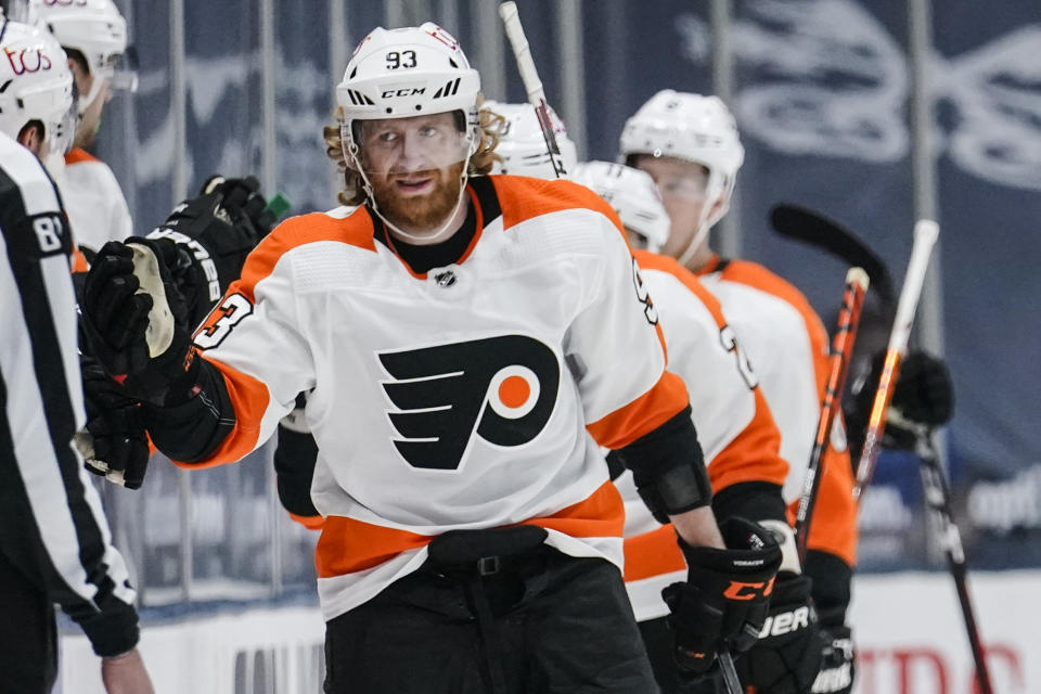 Philadelphia Flyers' Jakub Voracek (93) celebrates with teammates after scoring a goal during the second period of an NHL hockey game against the New York Islanders Thursday, April 8, 2021, in Uniondale, N.Y. (AP Photo/Frank Franklin II)