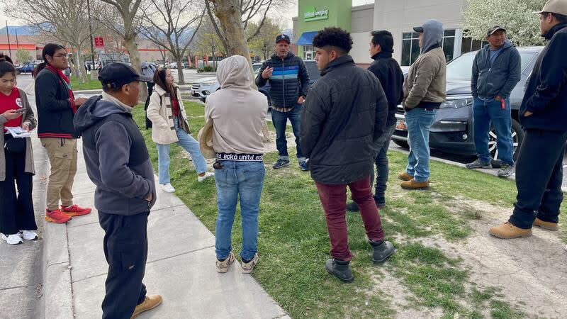 Luis Valentan of the National Day Laborer Organizing Network, center, speaks with day laborers outside Home Depot in West Valley City on Friday. Also present were organizers from Comunidades Unidas, an immigrant advocacy group. | Tim Vandenack, KSL.com