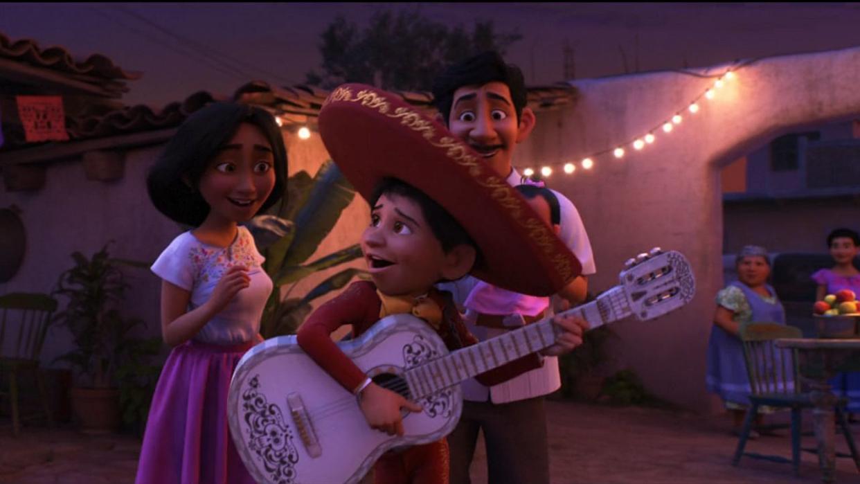  Miguel with parents in Coco 