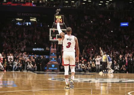 Apr 10, 2019; Brooklyn, NY, USA; Miami Heat guard Dwyane Wade (3) signals to the crowd after scoring in the third quarter against the Brooklyn Nets at Barclays Center. Mandatory Credit: Wendell Cruz-USA TODAY Sports.