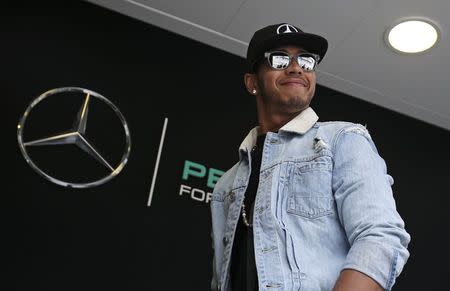 Mercedes Formula One driver Lewis Hamilton of Britain arrives in the paddock ahead the start of the third free practice session at the Monaco F1 Grand Prix May 23, 2015. REUTERS/Max Rossi