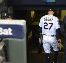 Colorado Rockies shortstop Trevor Story heads down the stairs to the clubhouse after Game 3 of a baseball National League Division Series against the Milwaukee Brewers Sunday, Oct. 7, 2018, in Denver. The Brewers won 6-0 to sweep the series in three games and move on to the National League Championship Series. (AP Photo/Joe Mahoney)