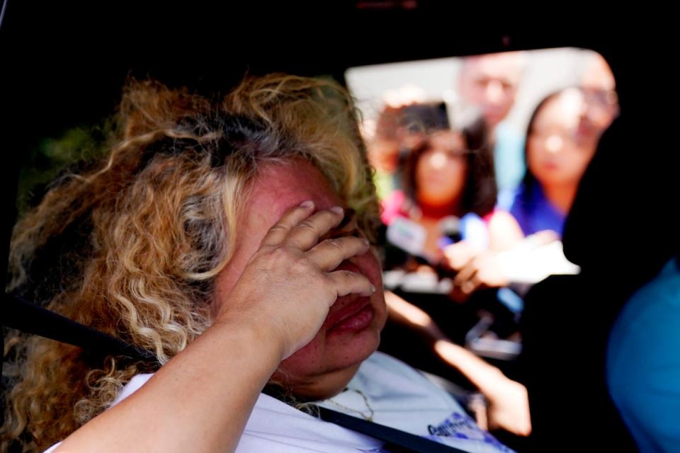 Grace Valencia, great aunt of shooting victim Uziyah Garcia, sobs after picking up a copy of the report (AP)