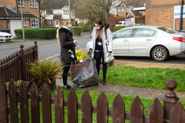 Volunteers deliver coronavirus test kits in Woking