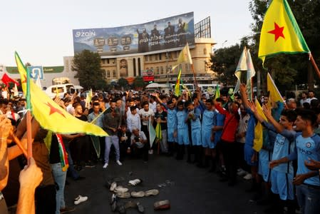 Kurds protest the Turkish offensive against Syria during a demonstration in Sulaimaniyah