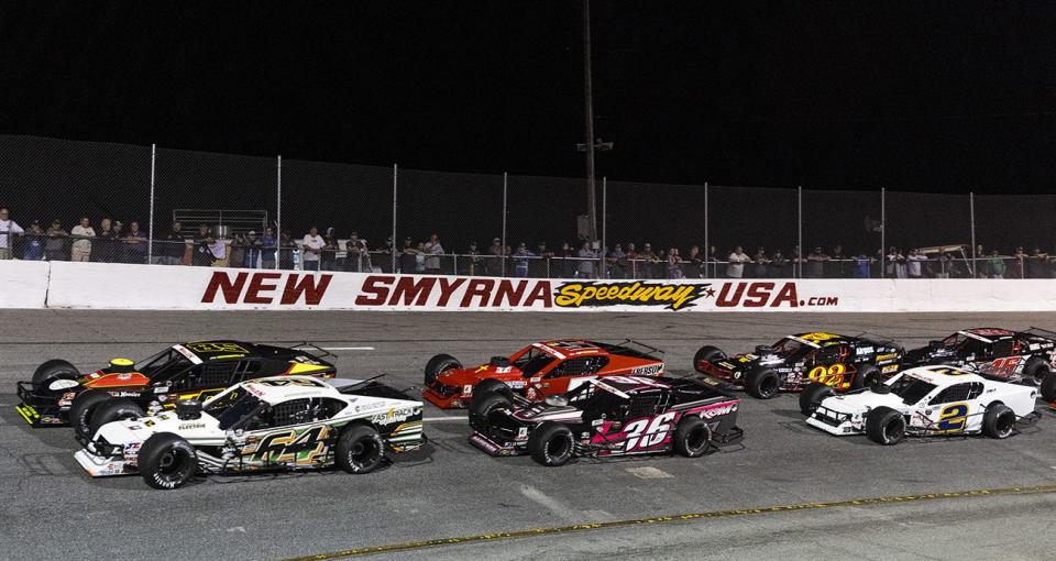 Cars in action during the New Smyrna Beach Visitors Bureau 200 for the NASCAR Whelen Modified Tour during night 2 of the World Series of Asphalt Stock Car Racing at New Smyrna Speedway in New Smyrna, Florida on February 11, 2023. (Adam Glanzman/NASCAR)