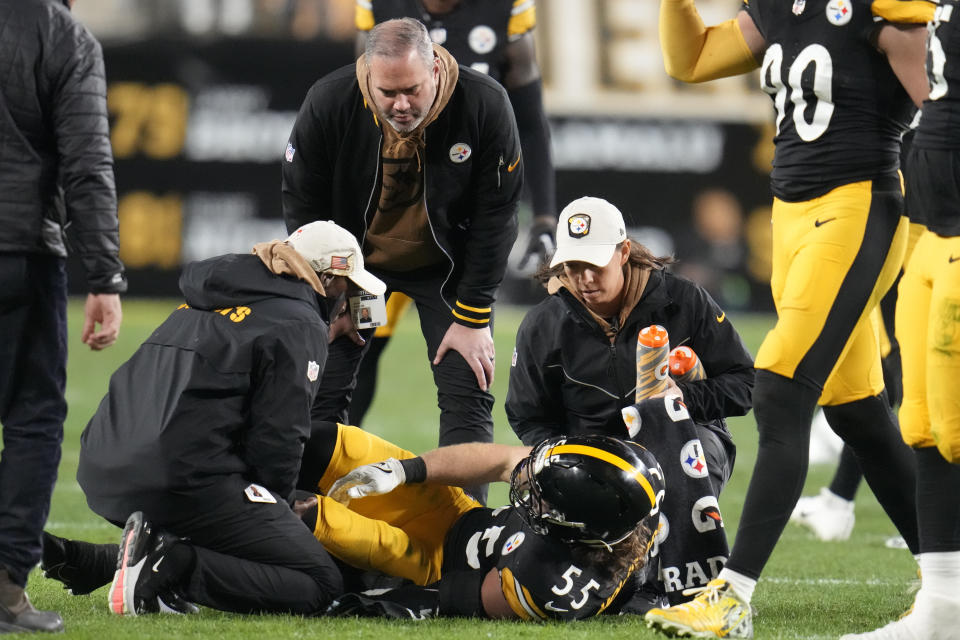 Pittsburgh Steelers linebacker Cole Holcomb (55) is cared for by the team's medical staff after he was injured during the first half of an NFL football game against the Tennessee Titans, Thursday, Nov. 2, 2023, in Pittsburgh. (AP Photo/Gene J. Puskar)